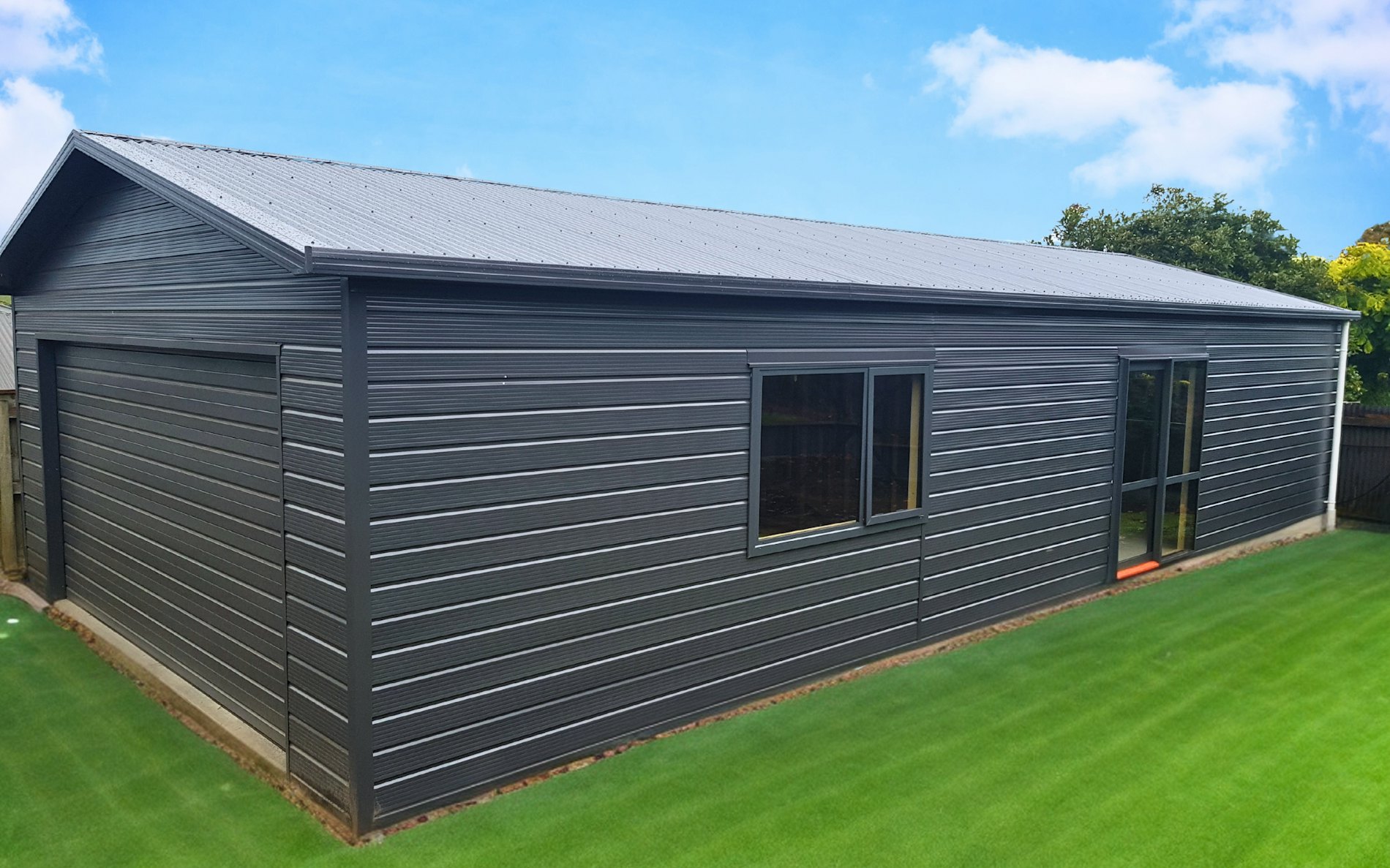 13.5m x 6m garage with a model train room to the back