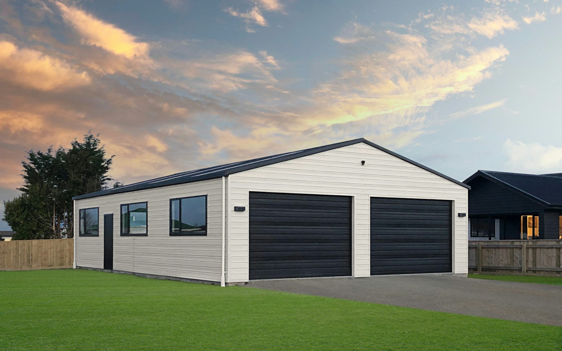 13.2m x 9m x 2.7m stud custom garage Superclad li Windows. Desert Sand with Tempest roof gutter and trim