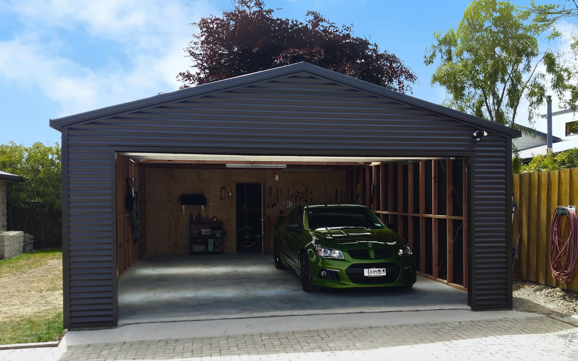 13m x 6m garage, Horizontal corrugate cladding  in COLORSTEEL® Ironsand and Sectional door 4.8m wide Ironsand