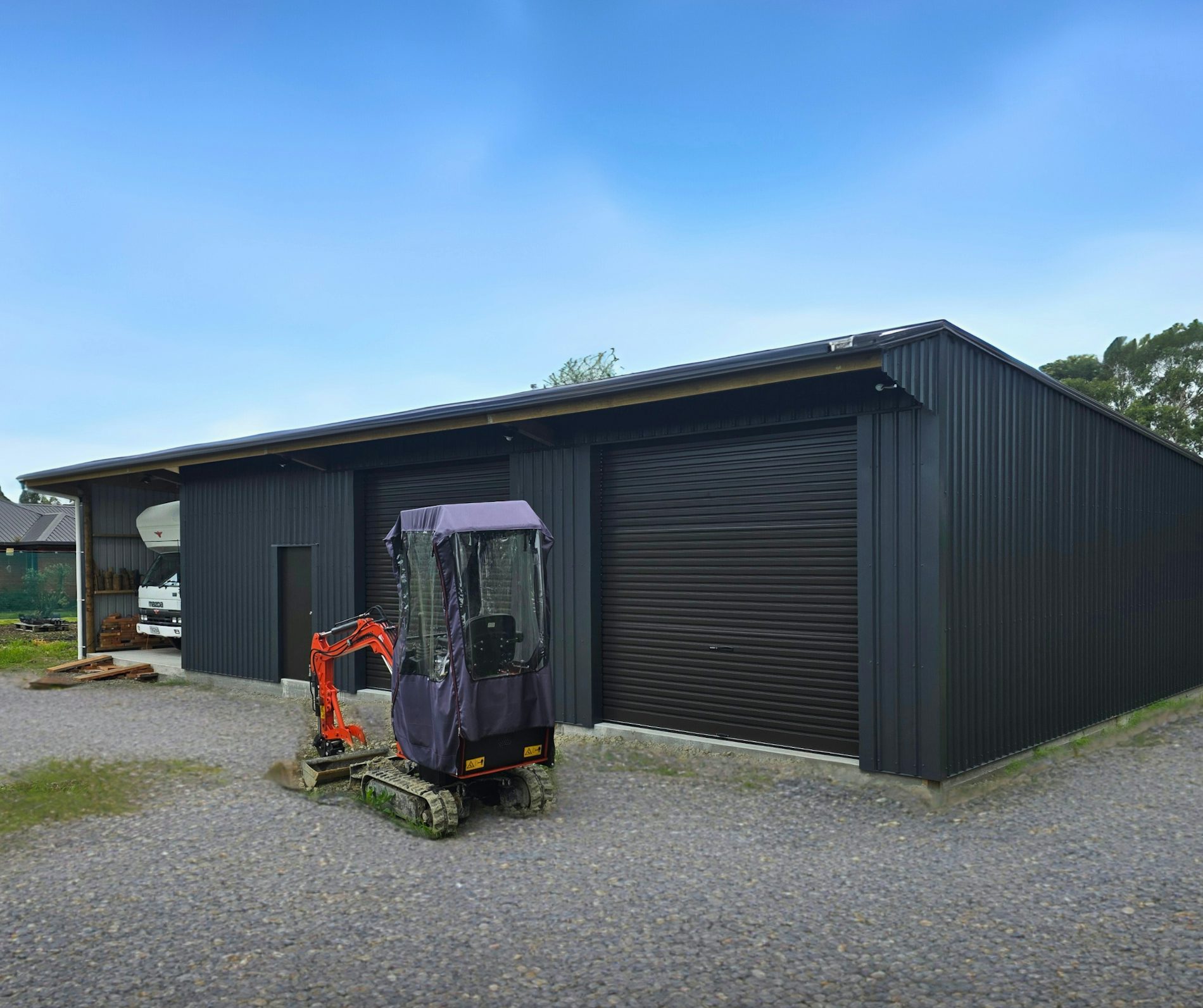 16.8m x 8.95m x 3.6m four-bay farm building, finished in COLORSTEEL® Grey Friars cladding with Ironsand doors,