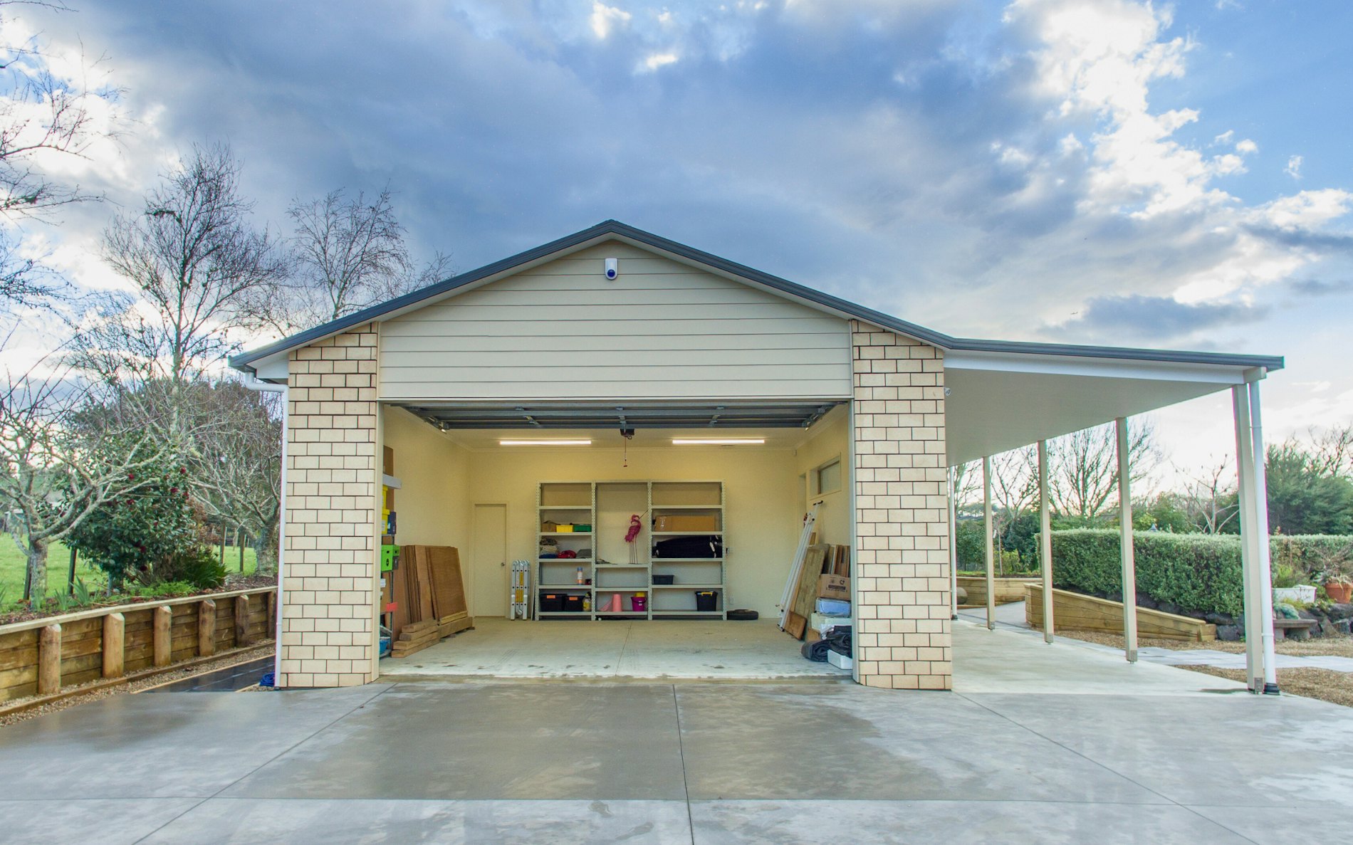  18m x 6m x 3m high. Cladding in brick with two separate vehicle entrances 1 x car & 1 x lawnmower plus a separate gym at the end
