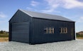 6m wide x 9m long x 3m stud garage, vertical 6 rib in Ebony with a Futura woodgrain sectional.