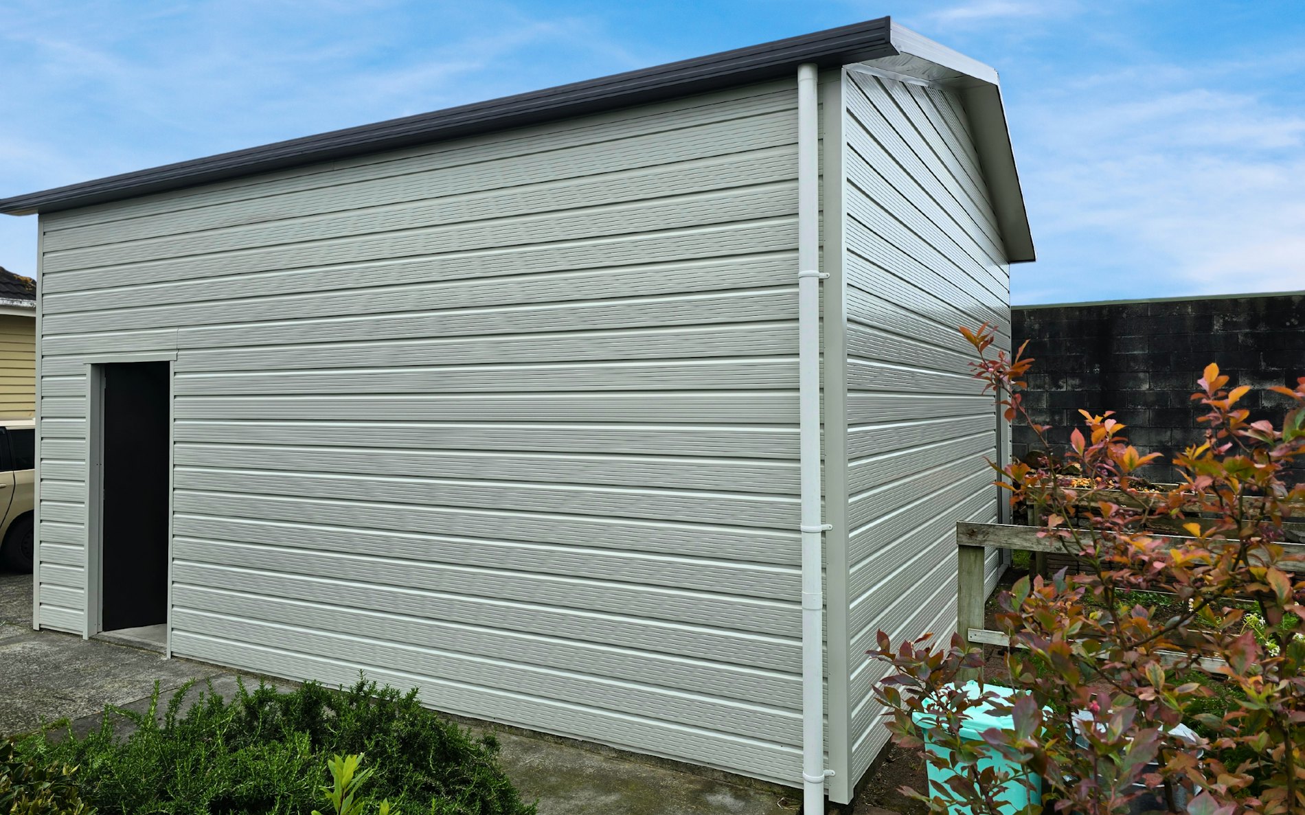6m x 6 x 3m H stud, Super clad cladding in Titiana and Ironsand door.