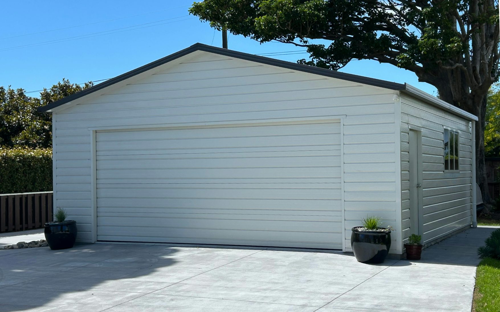 7.2m x 6.6m double garage,  Superclad cladding in Titania and roof in Ironsand 