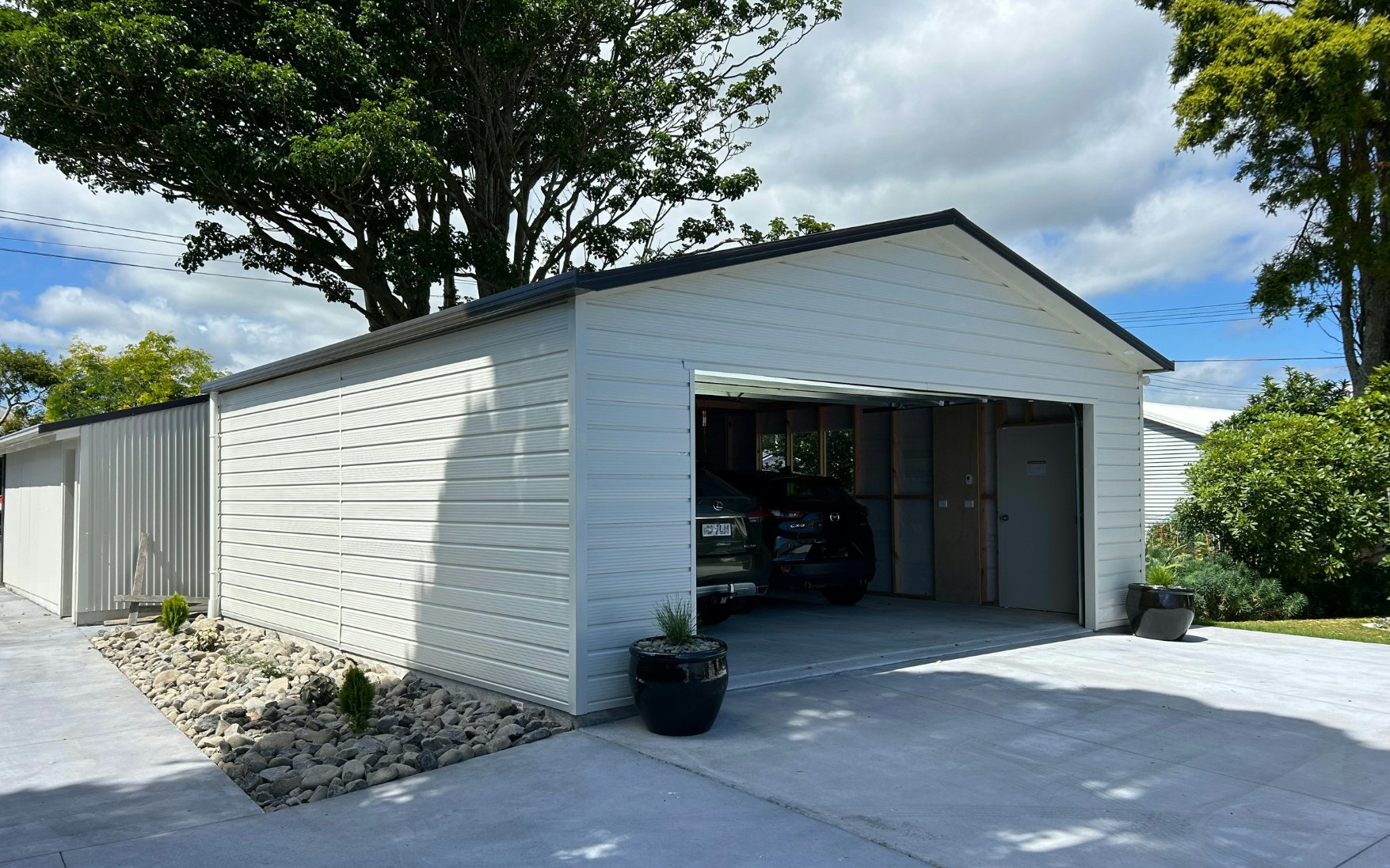 7.2m x 6.6m double garage,  Superclad cladding in Titania and roof in Ironsand 