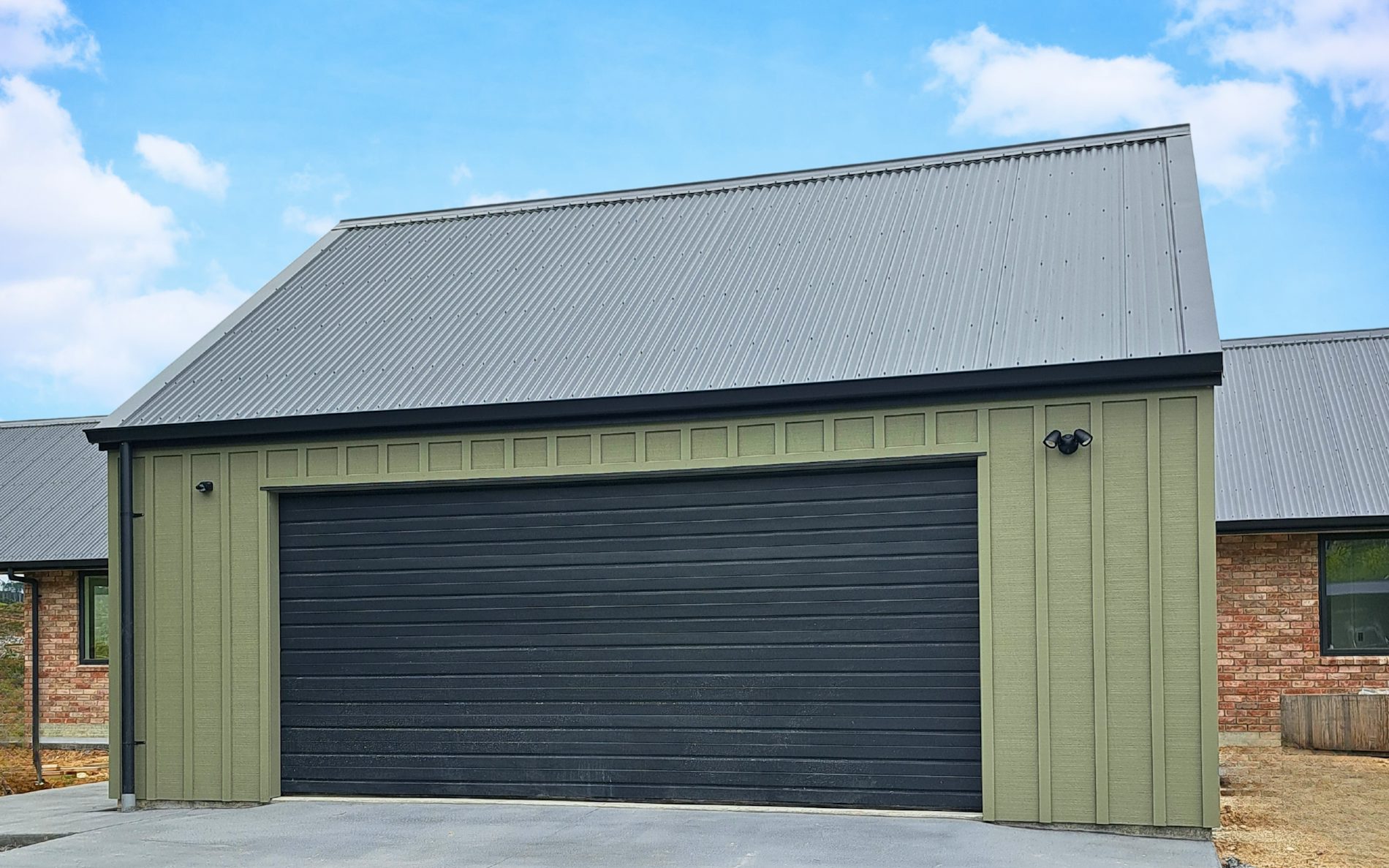 7.2m x 6.6m double garage, 35 degree pitch roof, in Board & Batten cladding