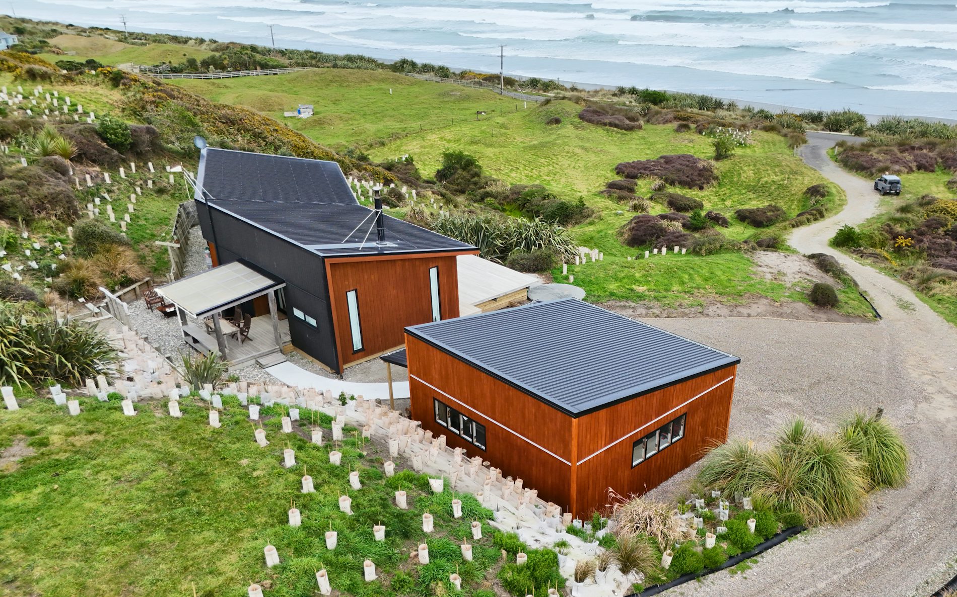 7m x 7.2m custom garage and storage, mono-pitch roof design in conjunction with stained shadowclad cladding