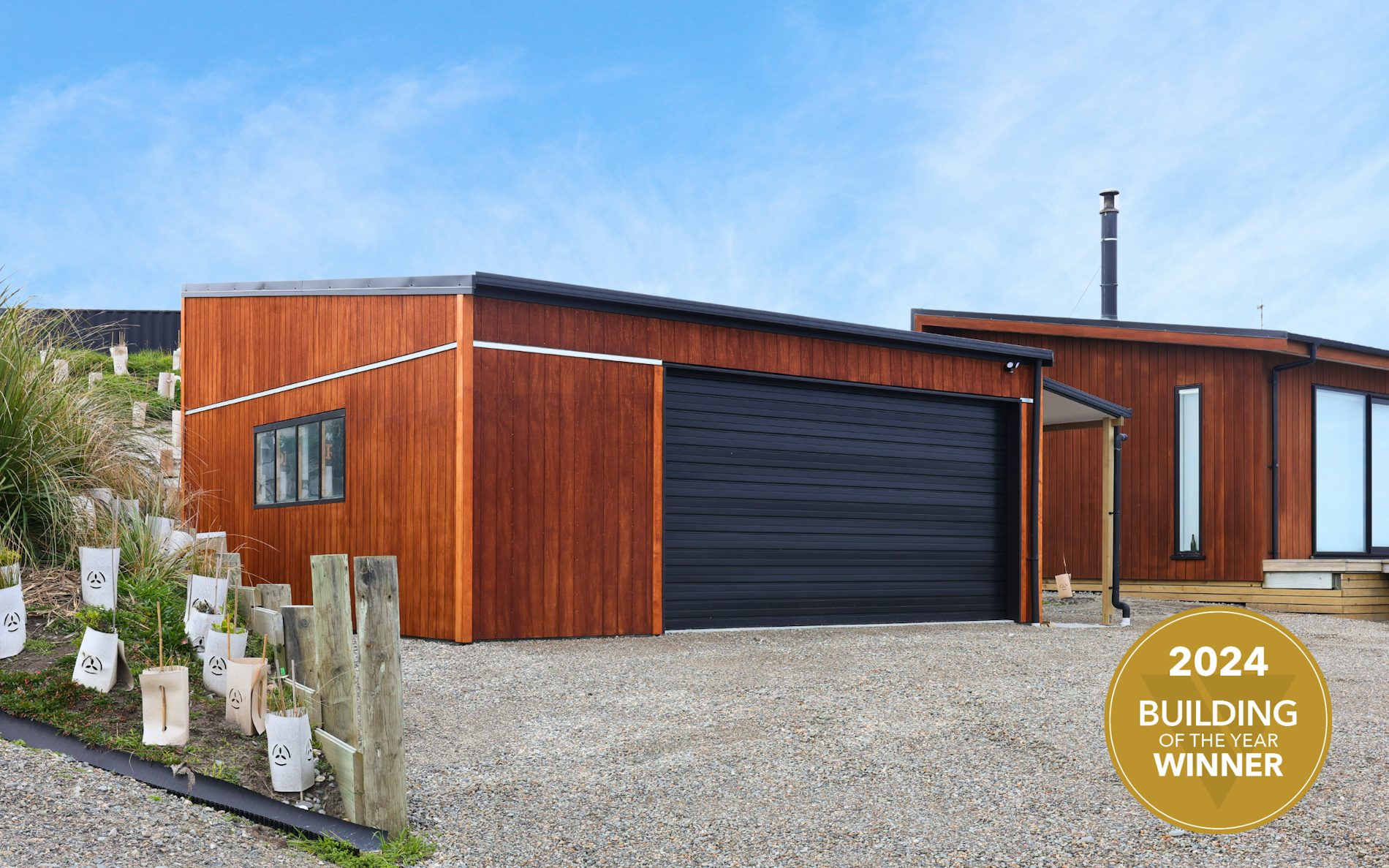 7m x 7.2m custom garage and storage, mono-pitch roof design in conjunction with stained shadowclad cladding