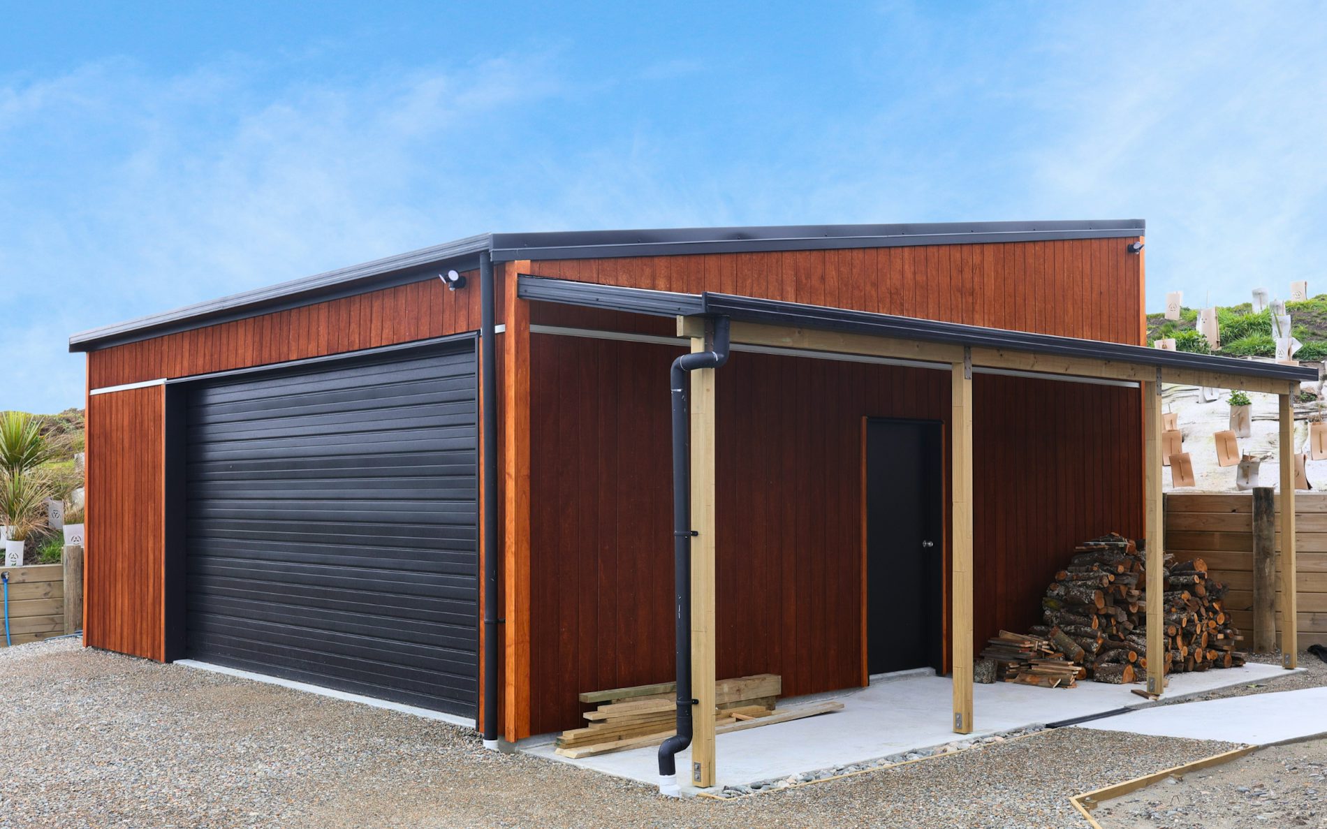 7m x 7.2m custom garage and storage, mono-pitch roof design in conjunction with stained shadowclad cladding