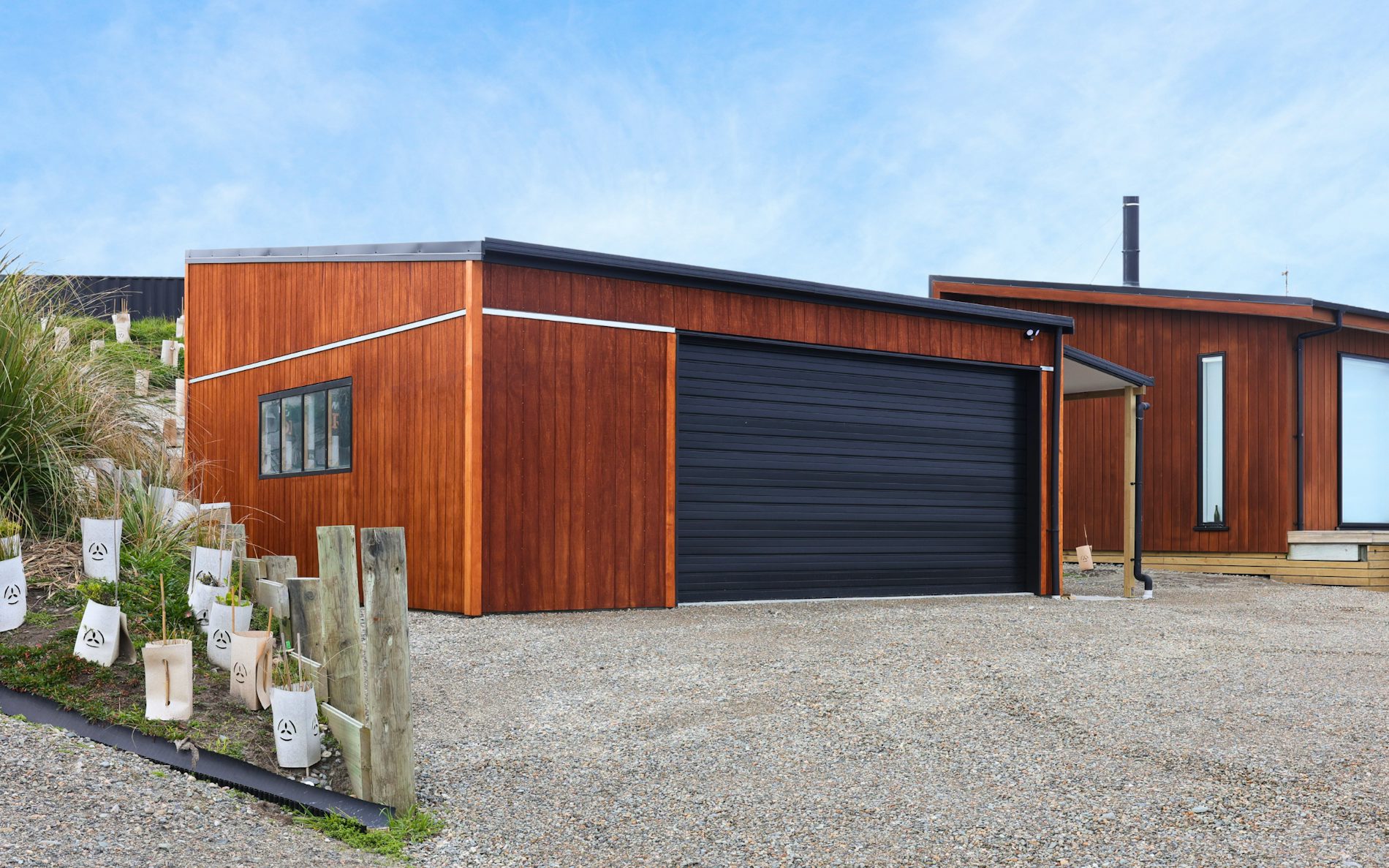 7m x 7.2m custom garage and storage, mono-pitch roof design in conjunction with stained shadowclad cladding