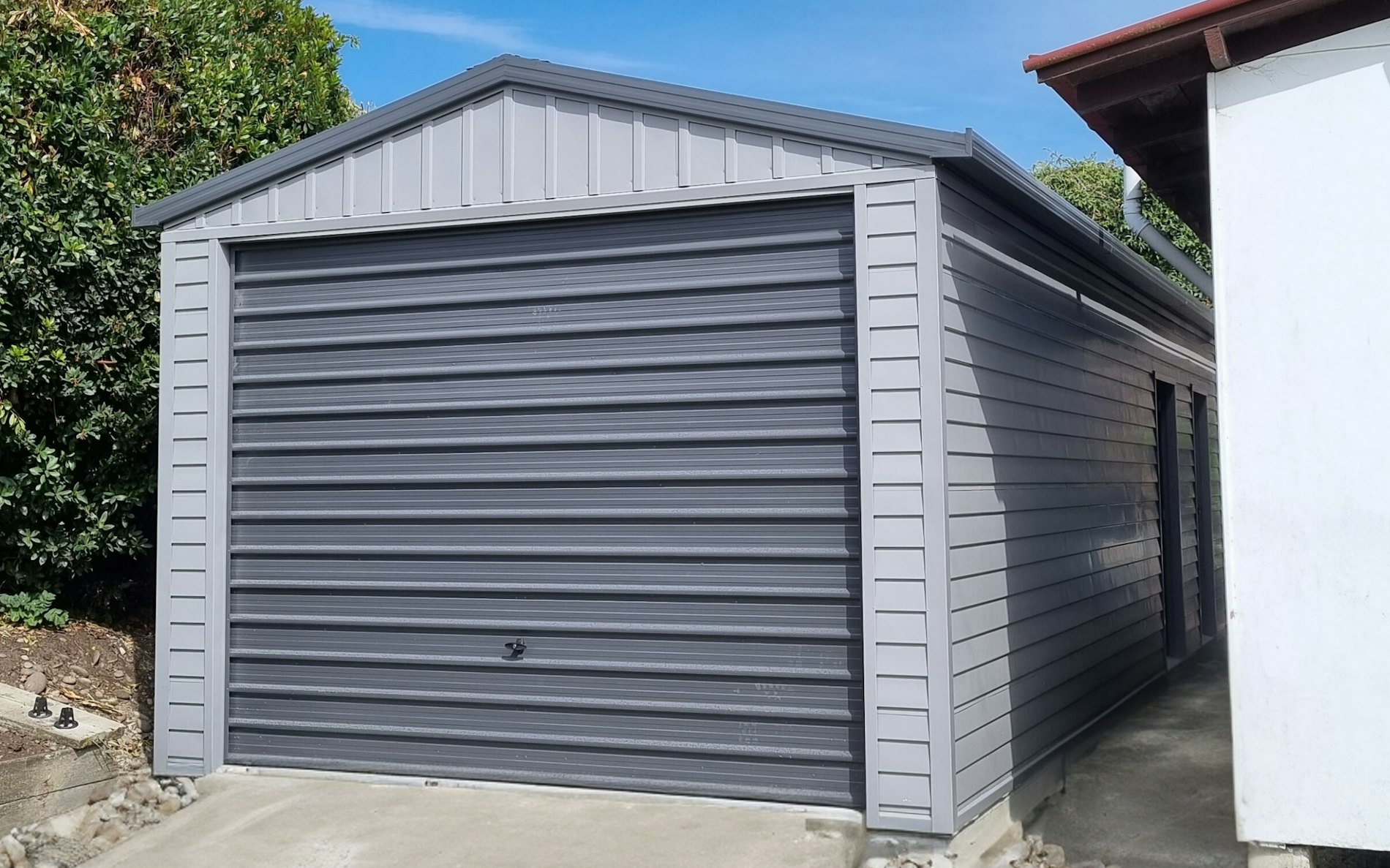 9.2m x 3.6m garage, Versaclad cladding  in COLORSTEEL® Sandstone Grey and Tilt door 3m wide Grey Friars