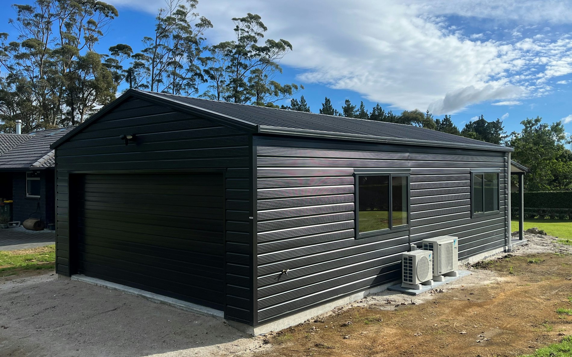 9.6m x 6.0m garage with sleepout, Superclad cladding in COLORSTEEL® FlaxPod