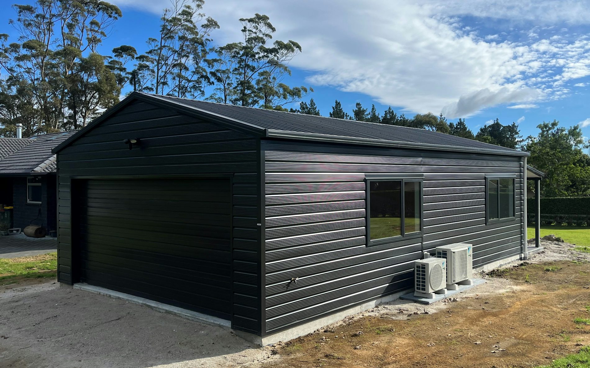 9.6m x 6.0m garage with sleepout, Superclad cladding in COLORSTEEL® FlaxPod