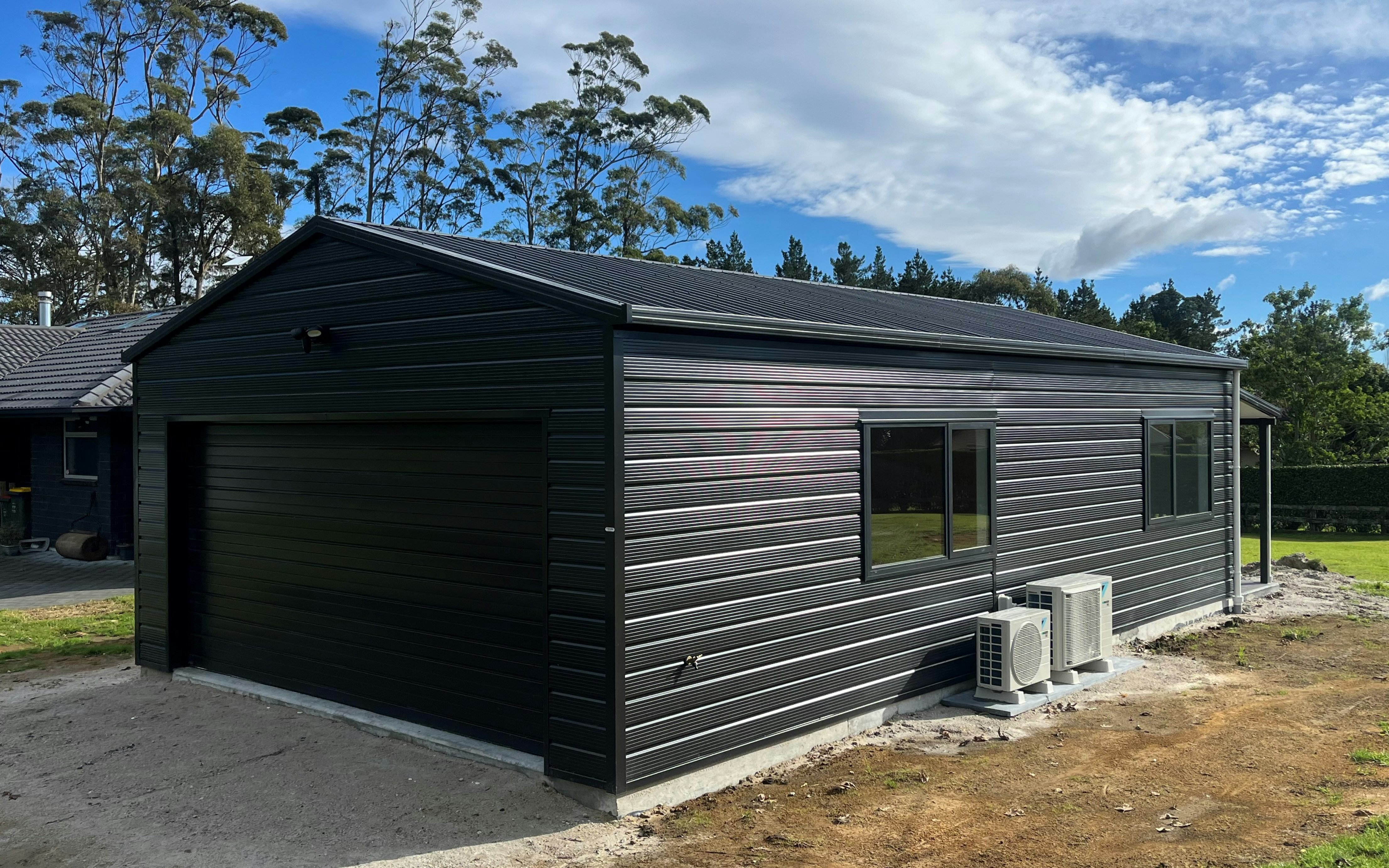 9.6m x 6.0m garage with sleepout, Superclad cladding in COLORSTEEL® FlaxPod