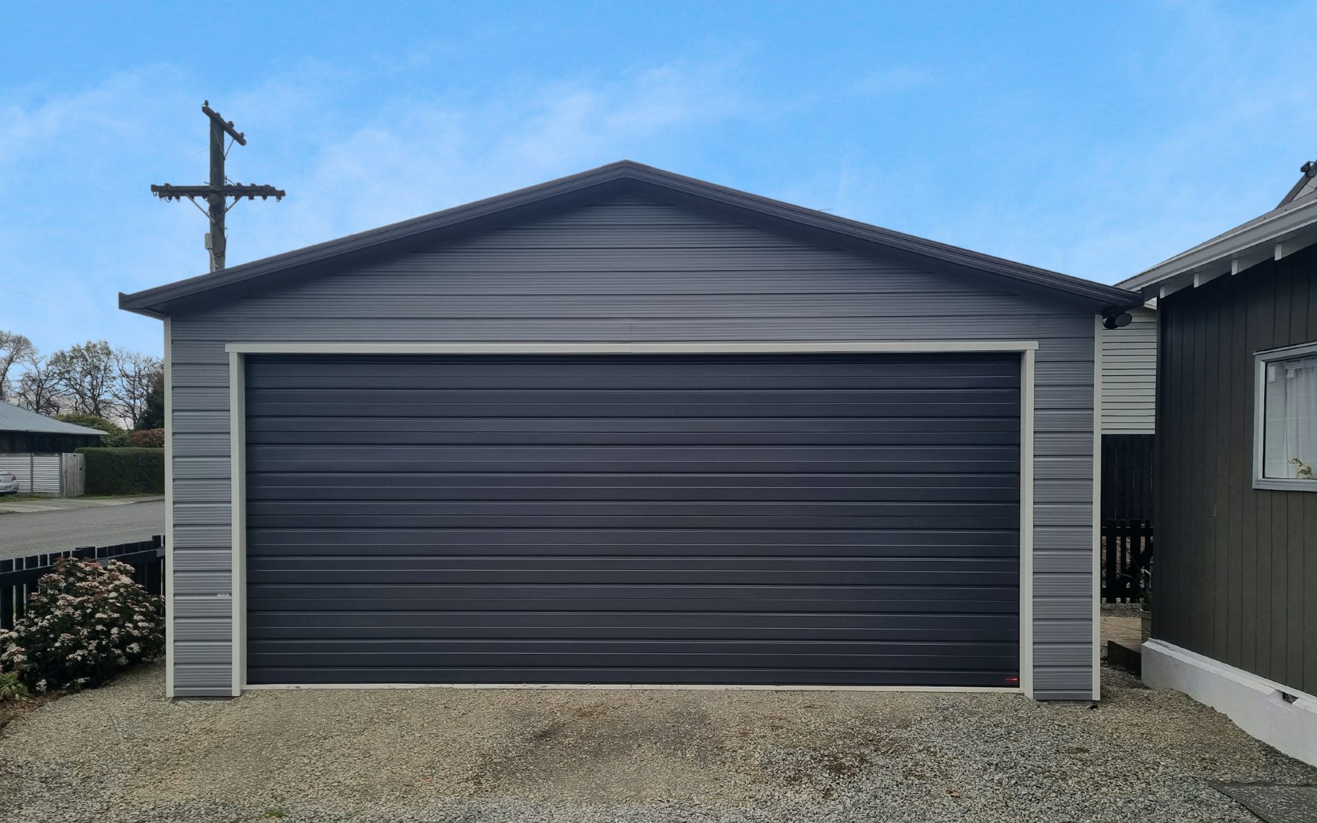 9m x 6m double garage, Superclad cladding  in COLORSTEEL® Sandstone Grey and Ironsand door 