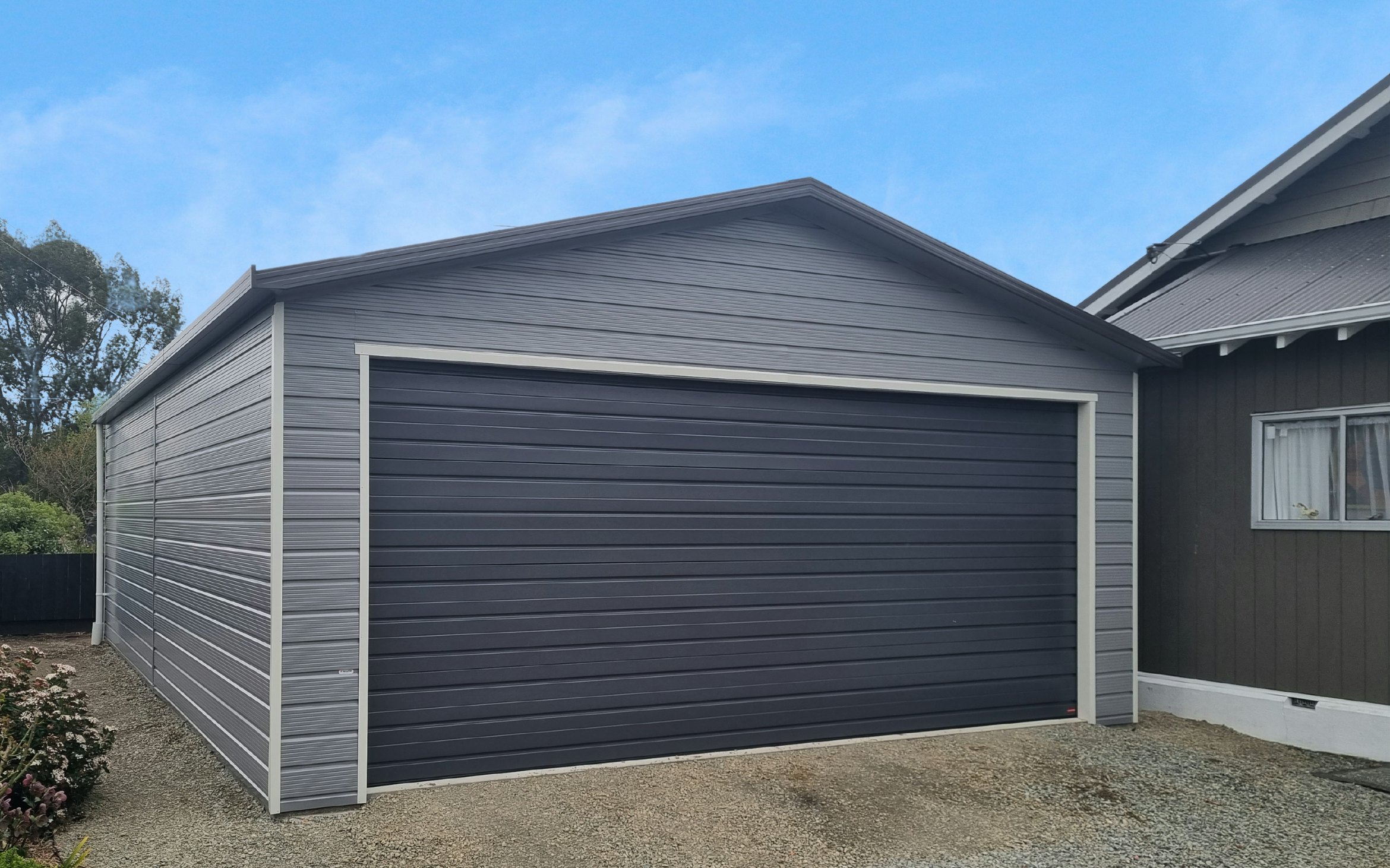 9m x 6m double garage, Superclad cladding  in COLORSTEEL® Sandstone Grey and Ironsand door 
