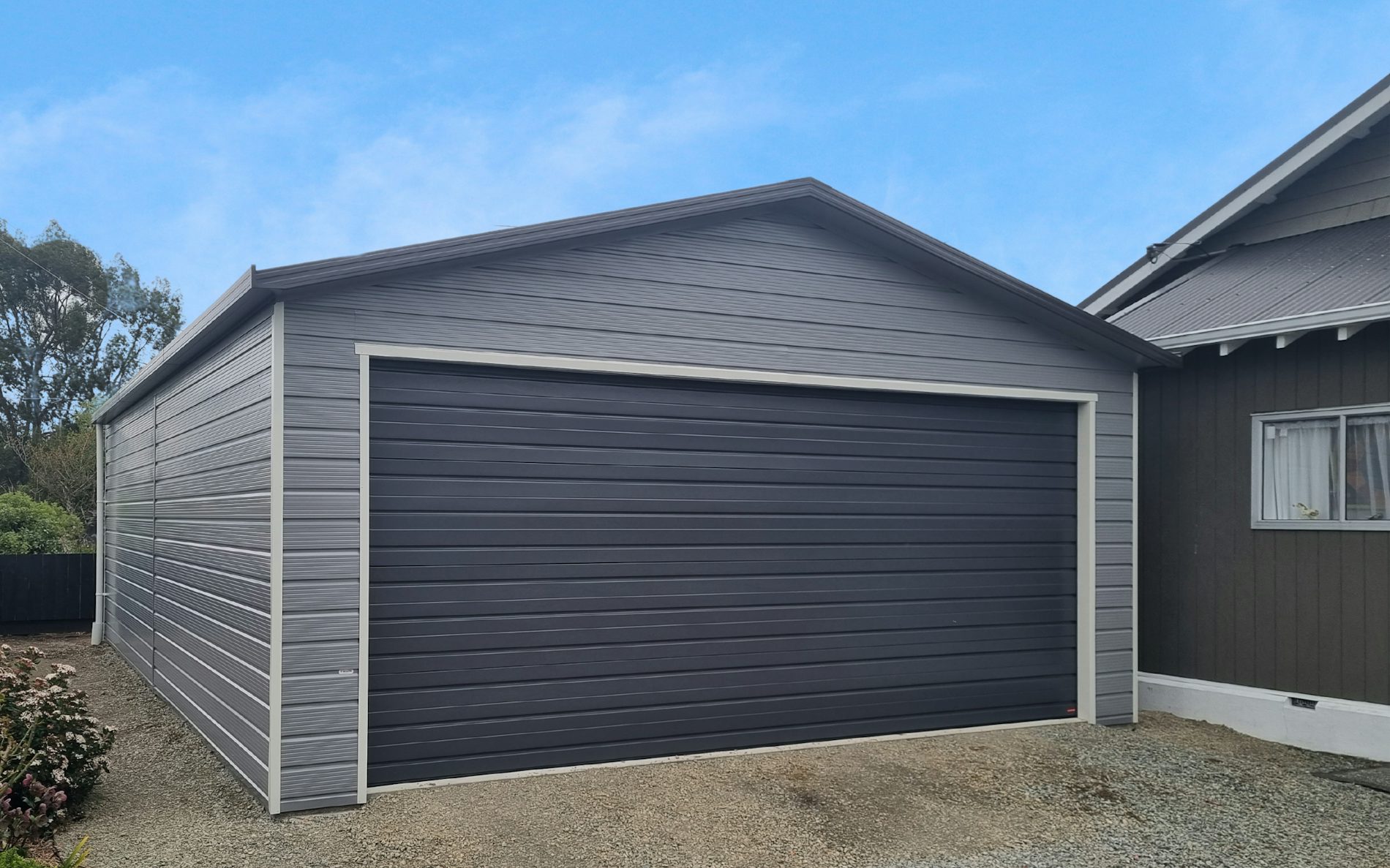 9m x 6m double garage, Superclad cladding  in COLORSTEEL® Sandstone Grey and Ironsand door 