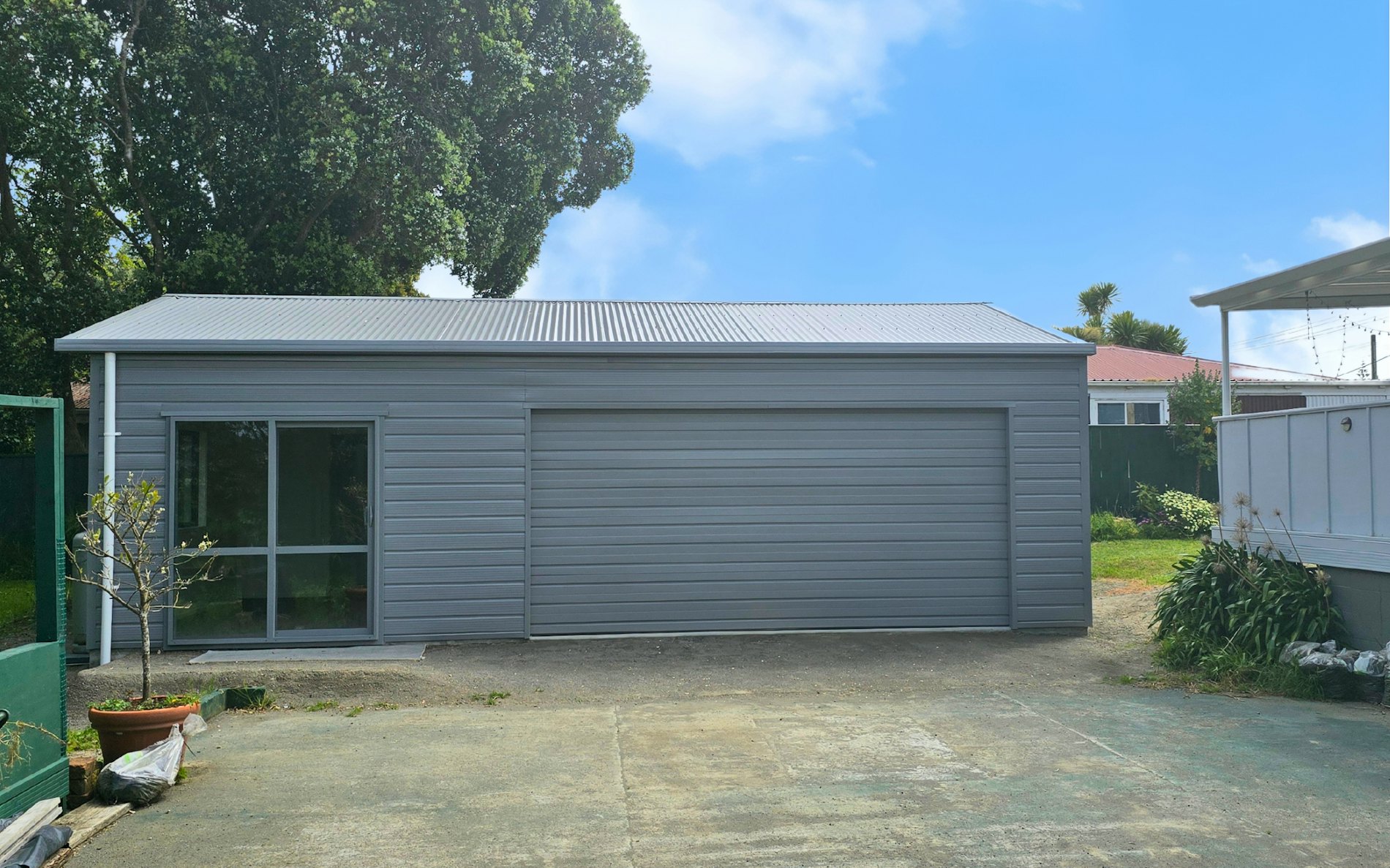 9m x 6m double garage and sleepout, Superclad cladding in Sandstone Grey