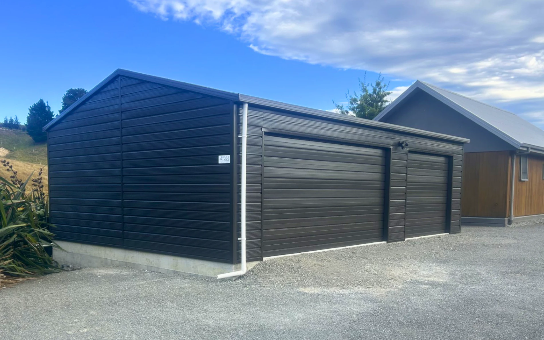 9m x 6m double garage, featuring Superclad cladding in COLORSTEEL® Ironsand
