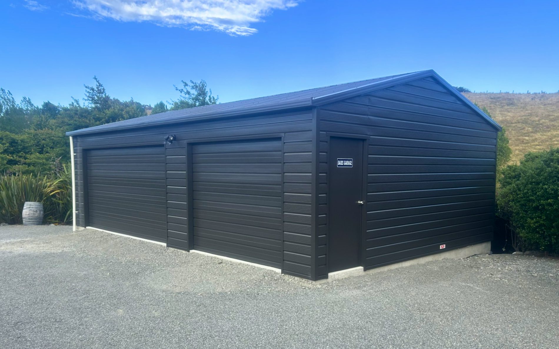9m x 6m double garage, featuring Superclad cladding in COLORSTEEL® Ironsand