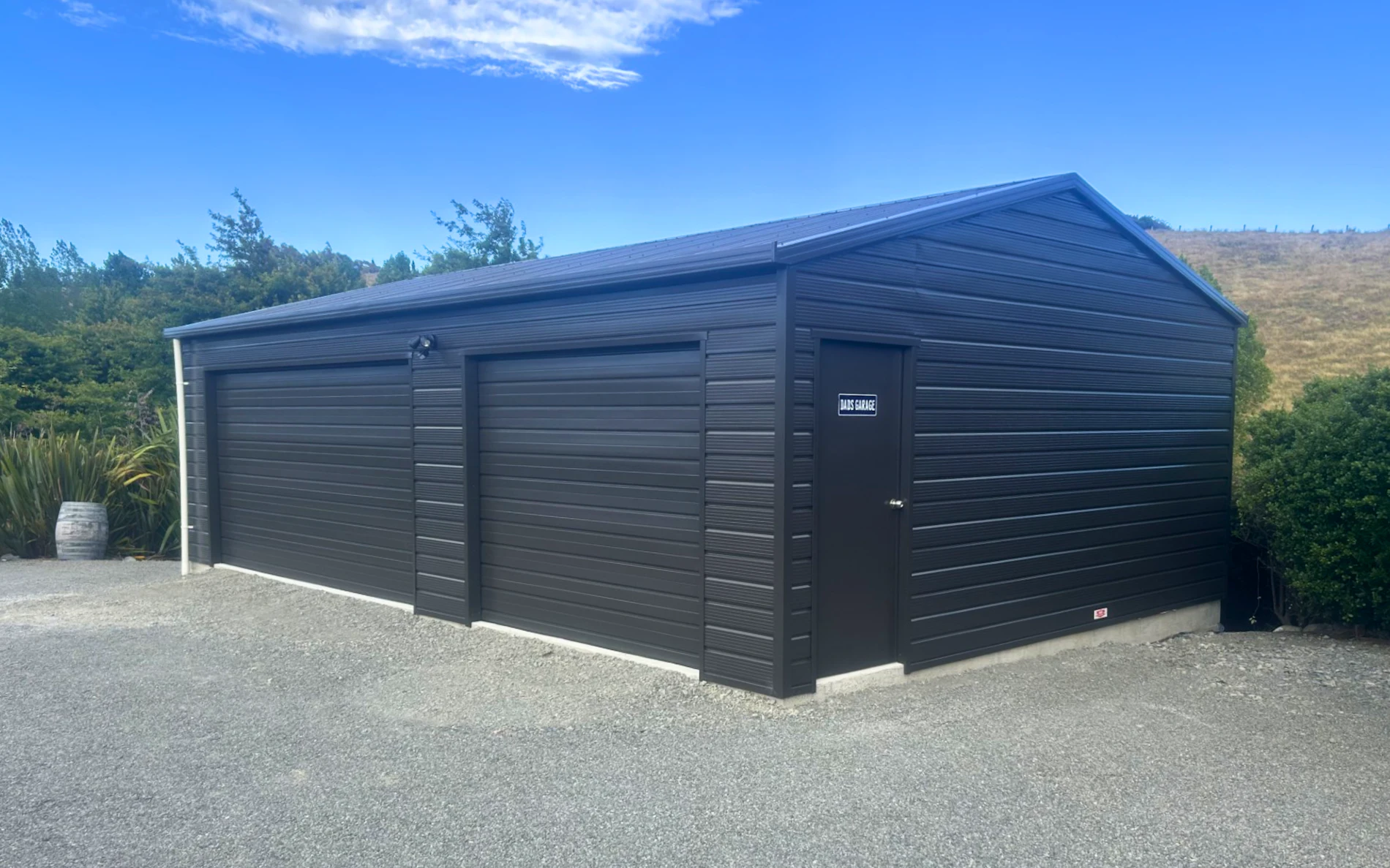 9m x 6m double garage, featuring Superclad cladding in COLORSTEEL® Ironsand