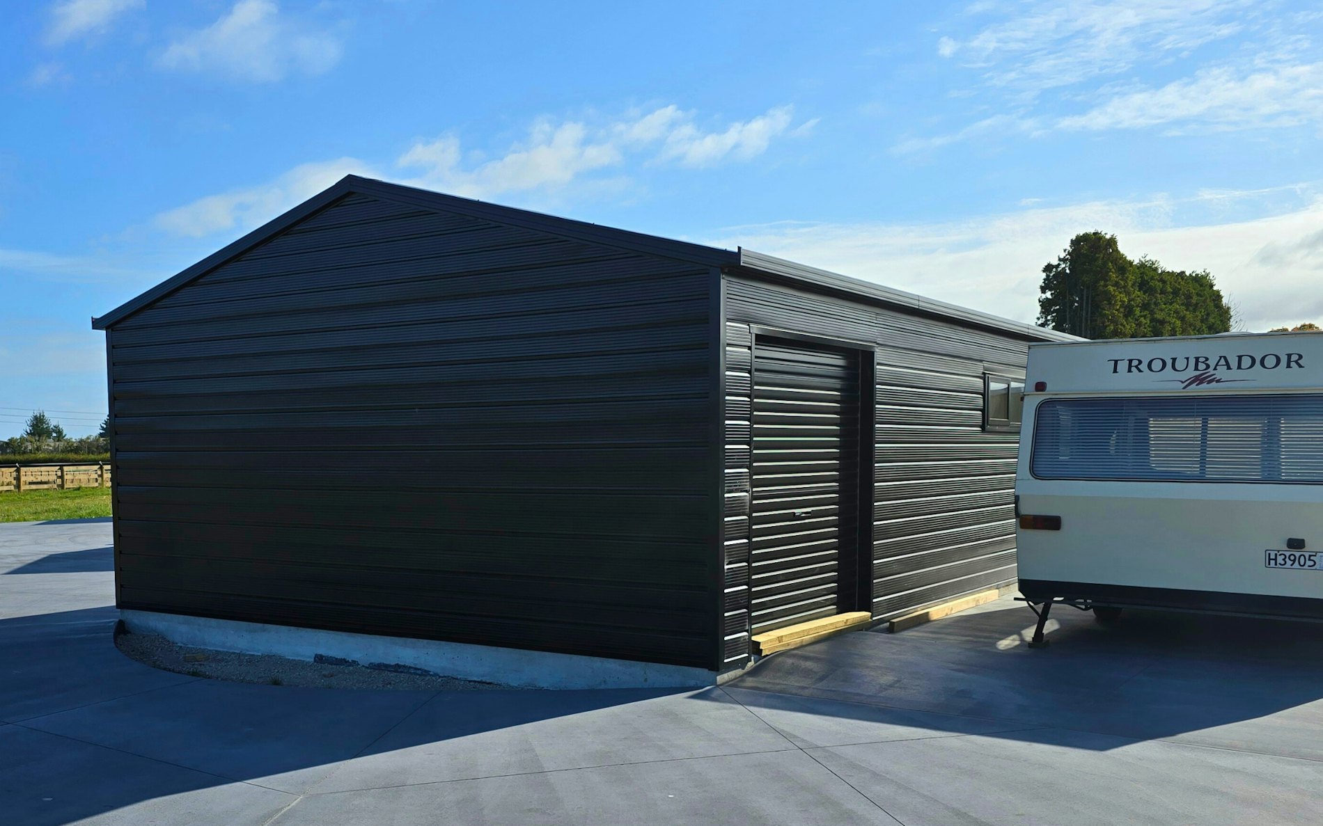 9m x 6m double garage with 2 hobbies rooms, Superclad cladding in Ebony