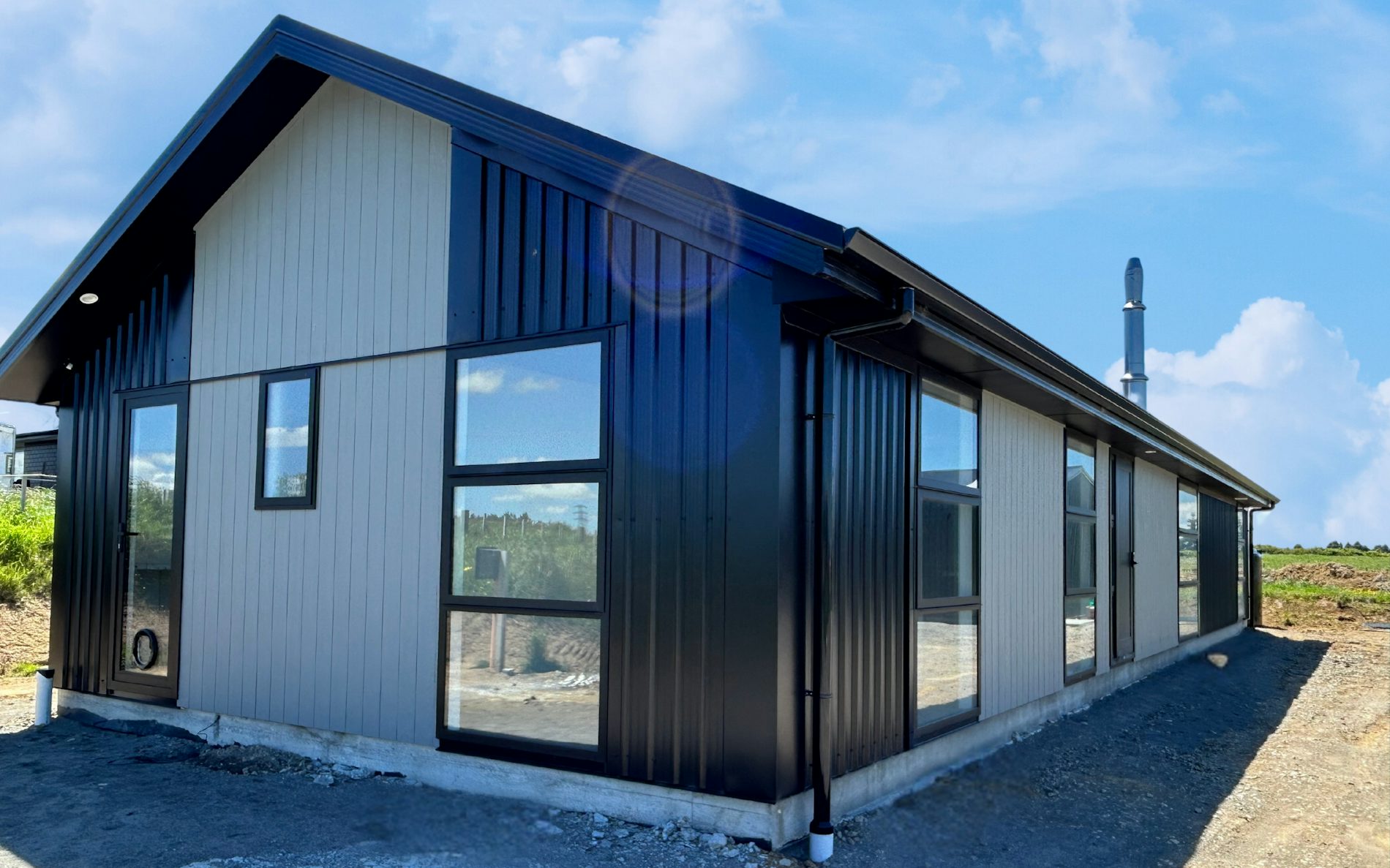 Modified version of the Hillary plan from Family Range, 3-bedroom layout and striking Vertical 6 Rib and BGC Duragroove Cladding