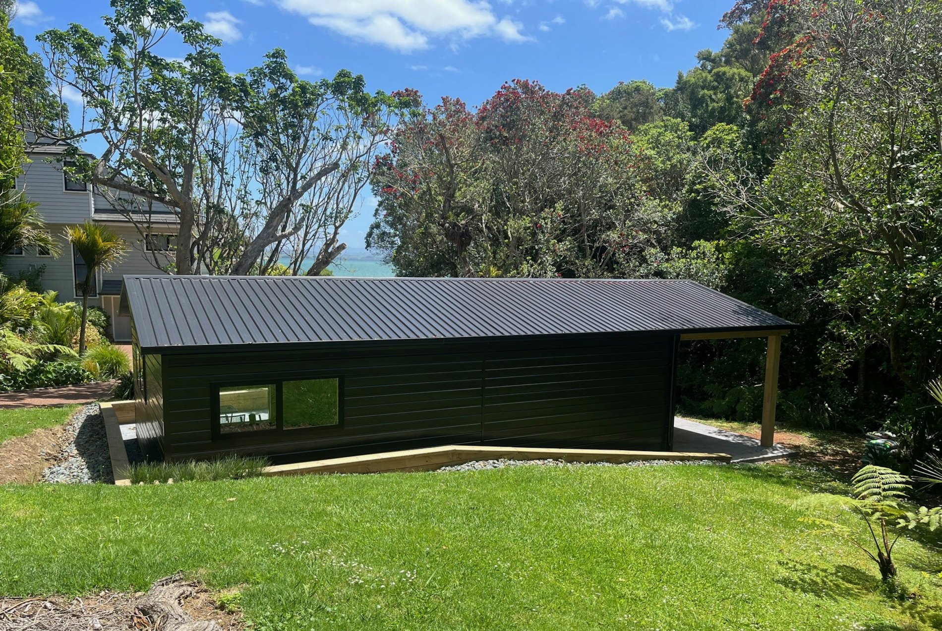 Custom garage with carport and sleepout